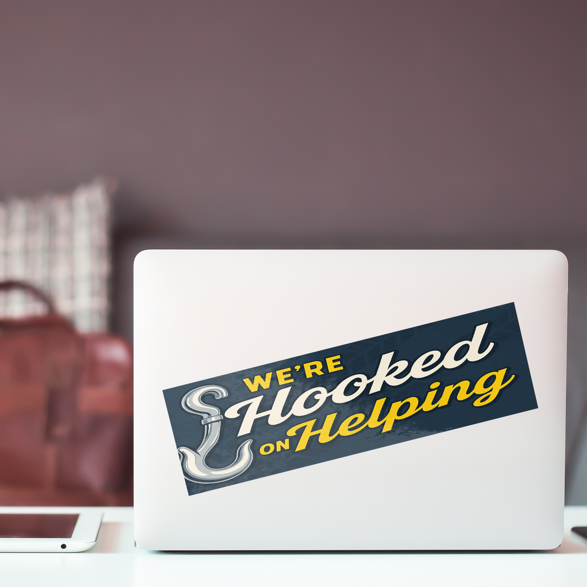 Were_Hooked_On_Helping_Others_WhiteBumperSticker-Laptop_Mockup.png